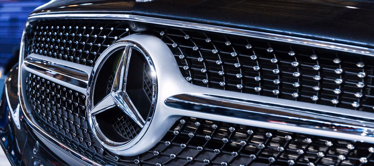 Close-up of a Mercedes-Benz grille on a black executive chauffeur car